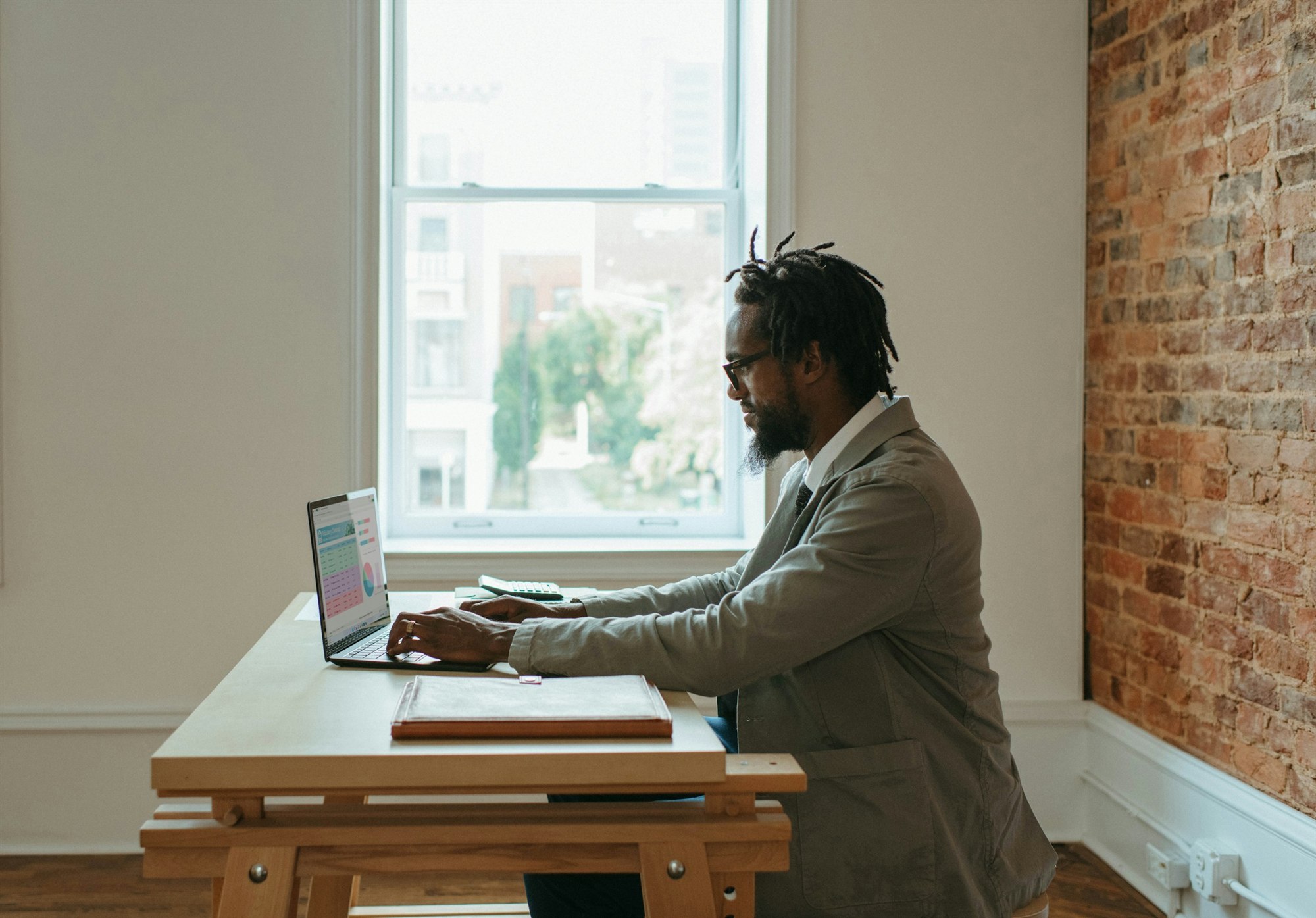 Analyst reviewing data at a desk